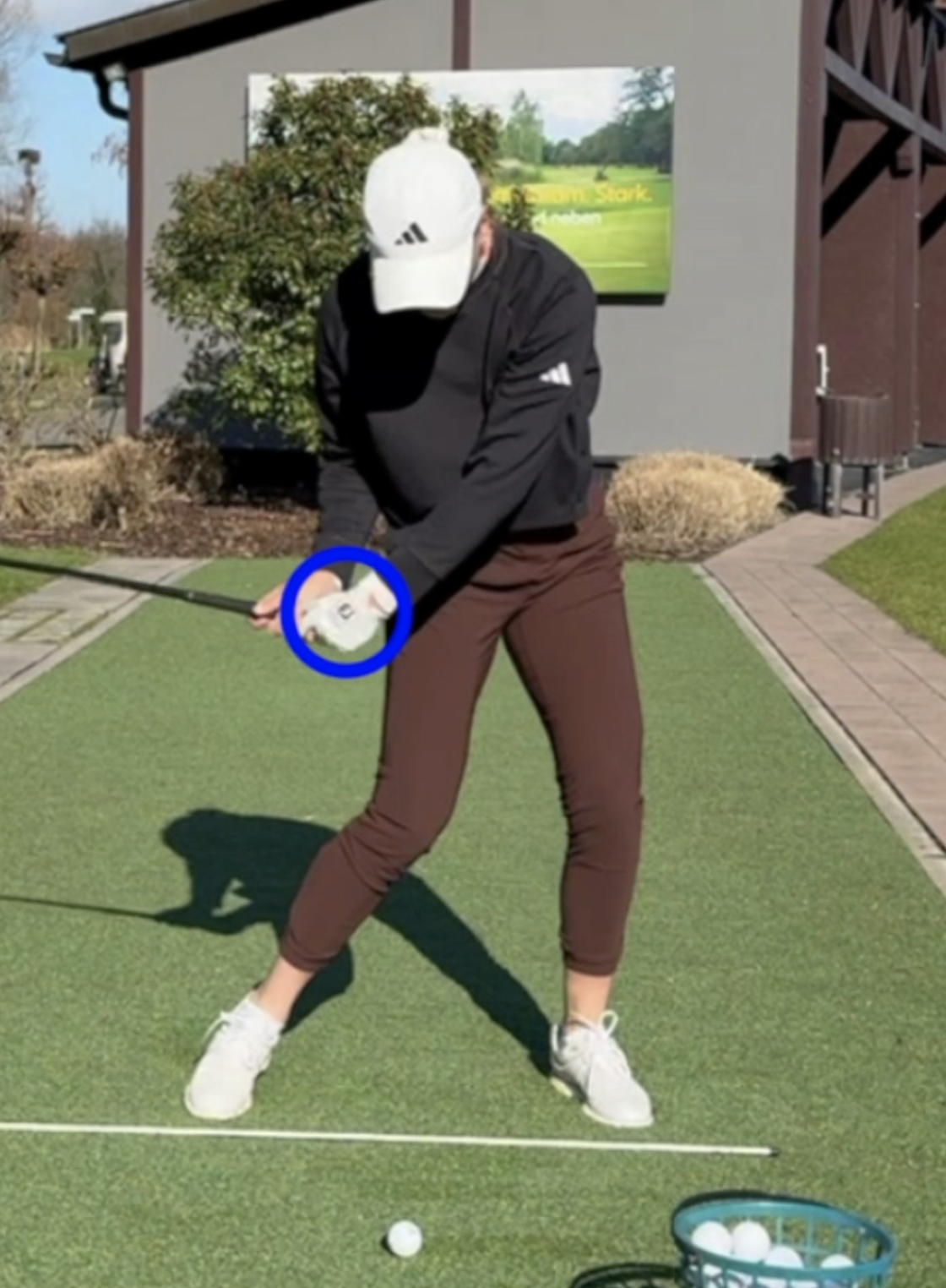 Lead wrist before impact points toward the camera