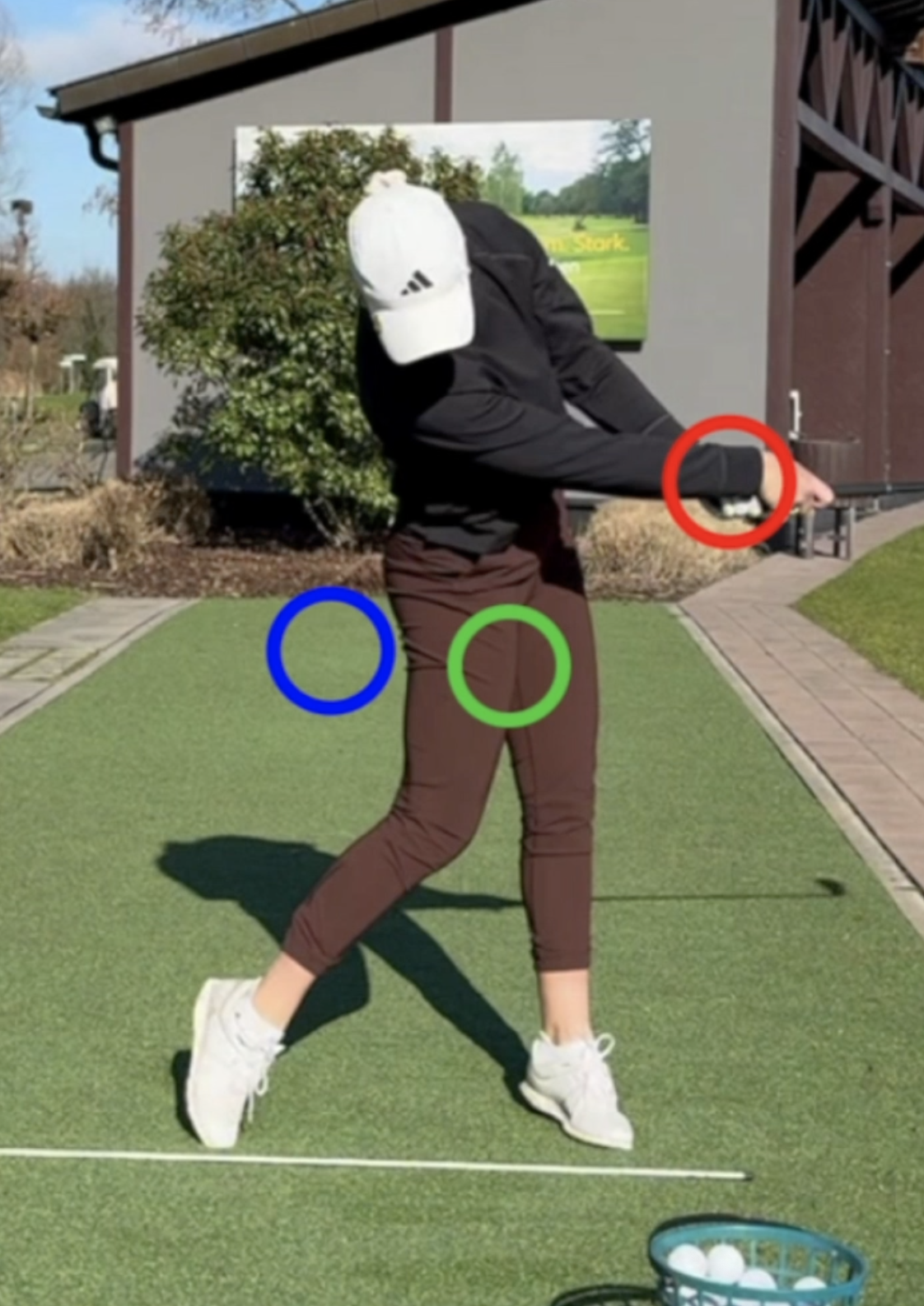 Lead wrist after impact points away from the camera
